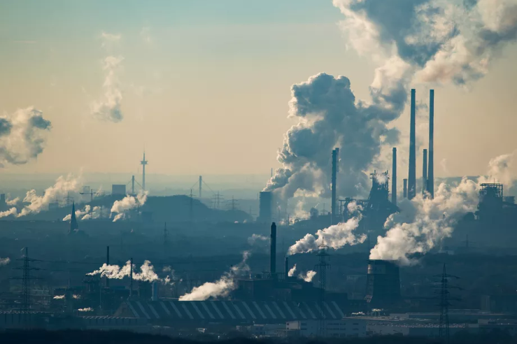 Steam and exhaust rise from a chemical factory and coking plant in Germany. Photo by Lukas Schulze/Getty Images