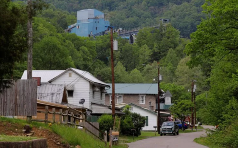 Coal camp company houses sit below the Lone Mountain Processing coal mine in St. Charles, Va., May 18, 2018. 