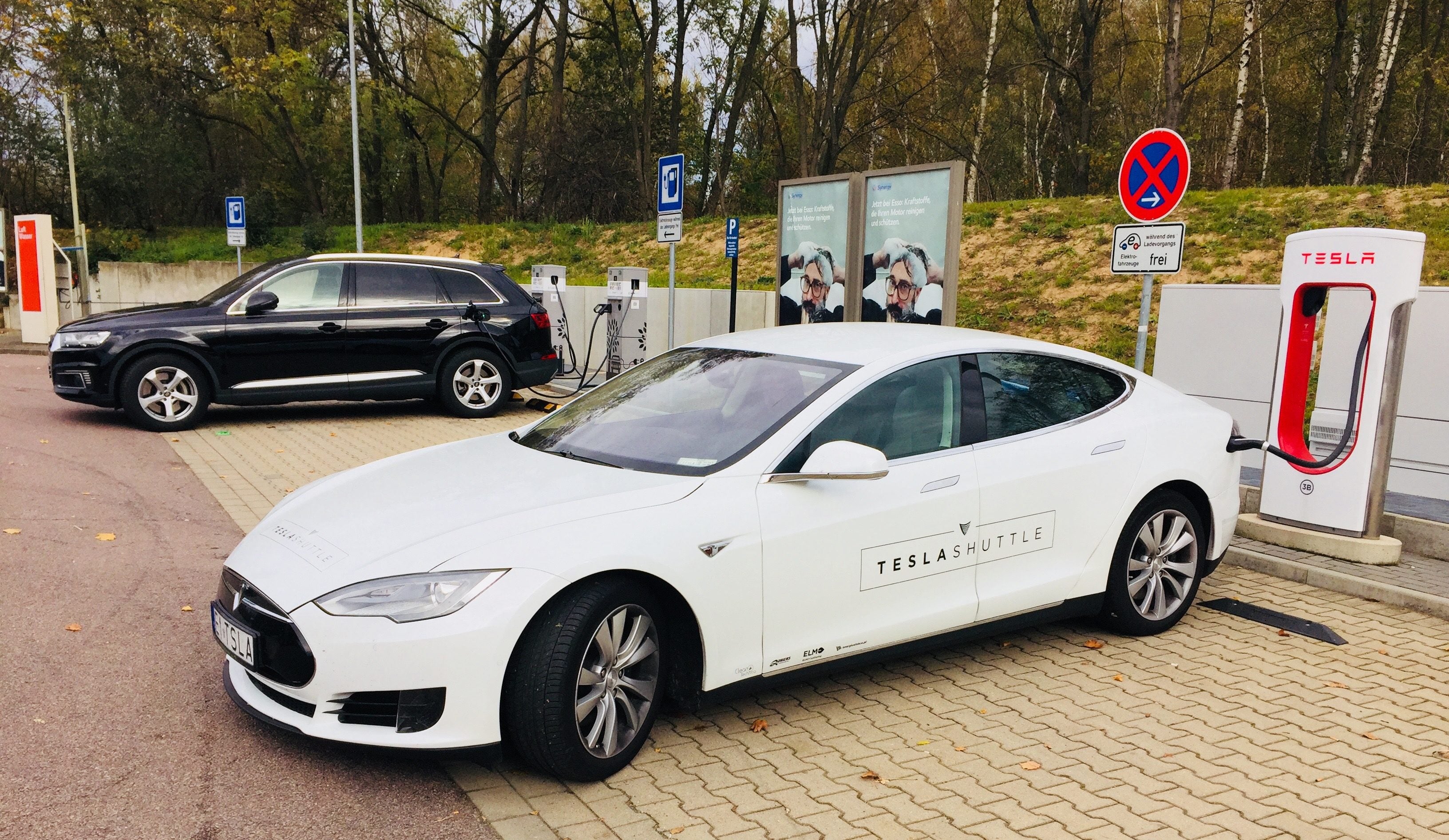 Rare plug-in vehicles charging in Germany. Photo credit: Tesla Shuttle | CleanTechnica