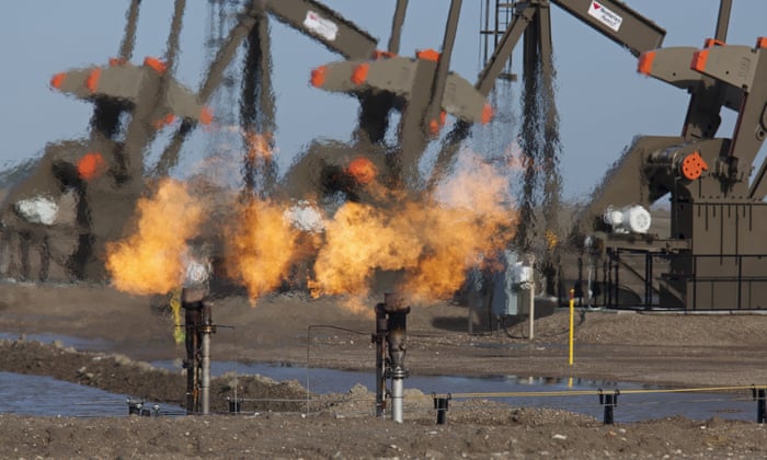 Natural gas is flared off as oil is pumped in the Bakken shale formation, Watford City, North Dakota, United States Photograph: REX Shutterstock