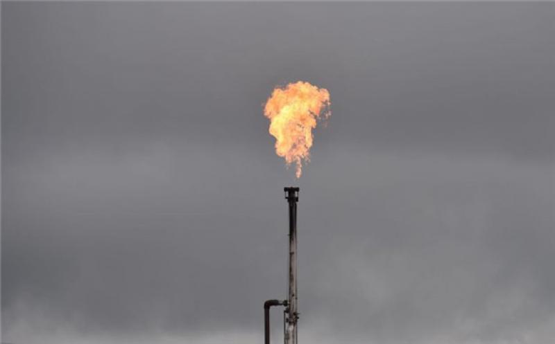 A gas flare from an oil well is seen near Williston, North Dakota, on Sept. 6, 2016. ROBYN BECK/AFP/GETTY IMAGES