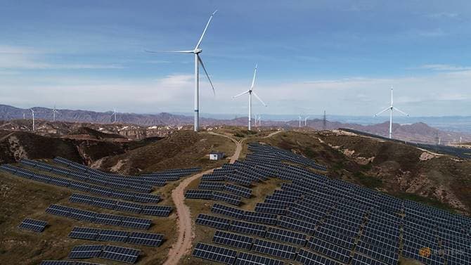 Wind turbines and solar panels are seen at a wind and solar power plant by State Power Investment Corporation (SPIC) in Zhangjiakou, Hebei province, China, Oct 29, 2018. (Photo: Reuters) 