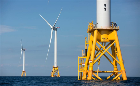 FIRST OFFSHORE WIND FARM: Three wind turbines from the Deepwater Wind project stand in the Atlantic Ocean off Block Island, R.I.