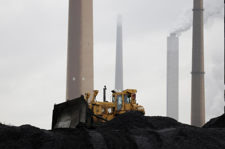 FILE PHOTO: A bulldozer moves coal at the Murray Energy Corporation port facility in Powhatan Point, Ohio, U.S., November 7, 2017. REUTERS/Joshua Roberts/File Photo