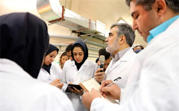 In this photo released by the Atomic Energy Organization of Iran, spokesperson for the organization Behrouz Kamalvandi, centre, briefs the media while visiting Fordo nuclear site near Qom, south of Tehran, on Sat., Nov. 9. (Atomic Energy Organization of Iran/The Associated Press)