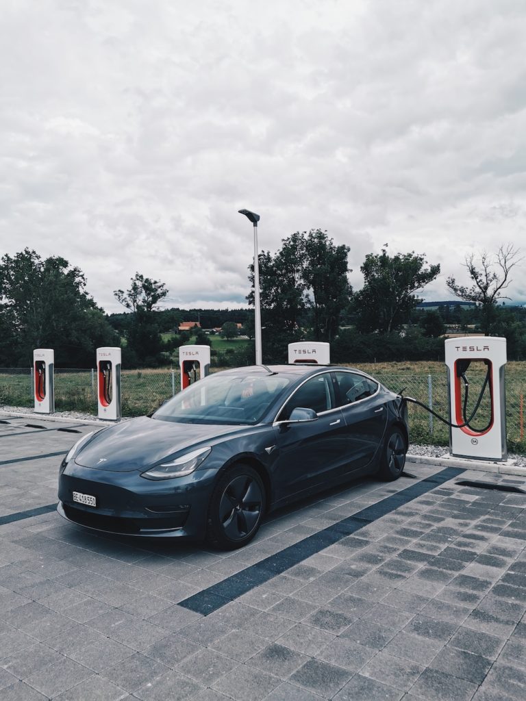 A Tesla EV charging. Photo: Unsplash.