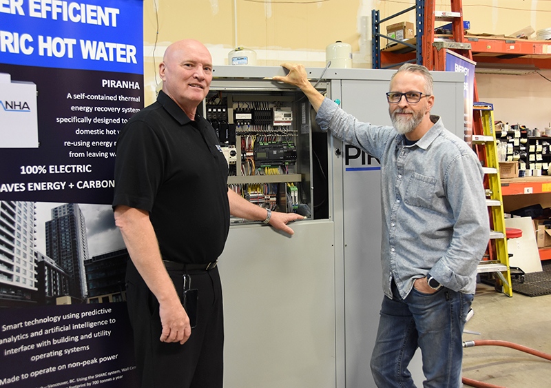 Lynn Mueller, CEO of SHARC Energy Systems, and Trevor Funk, director of North American operations, have developed the Piranha heating and cooling wastewater heat and recovery system, which can take a building’s wastewater and use the energy produced for hot water production and air conditioning. - Diane Strandberg