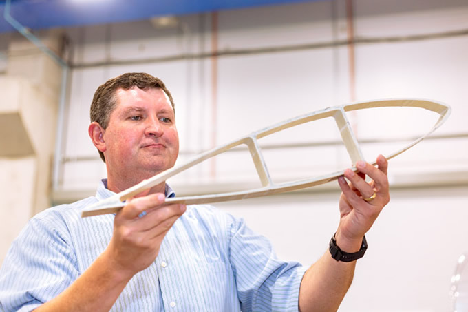 Dr. Todd Griffith, associate professor of mechanical engineering, demonstrates his blade design for an offshore floating wind turbine. Griffith is leading a team of UT Dallas researchers and collaborators to build a prototype for the turbine.