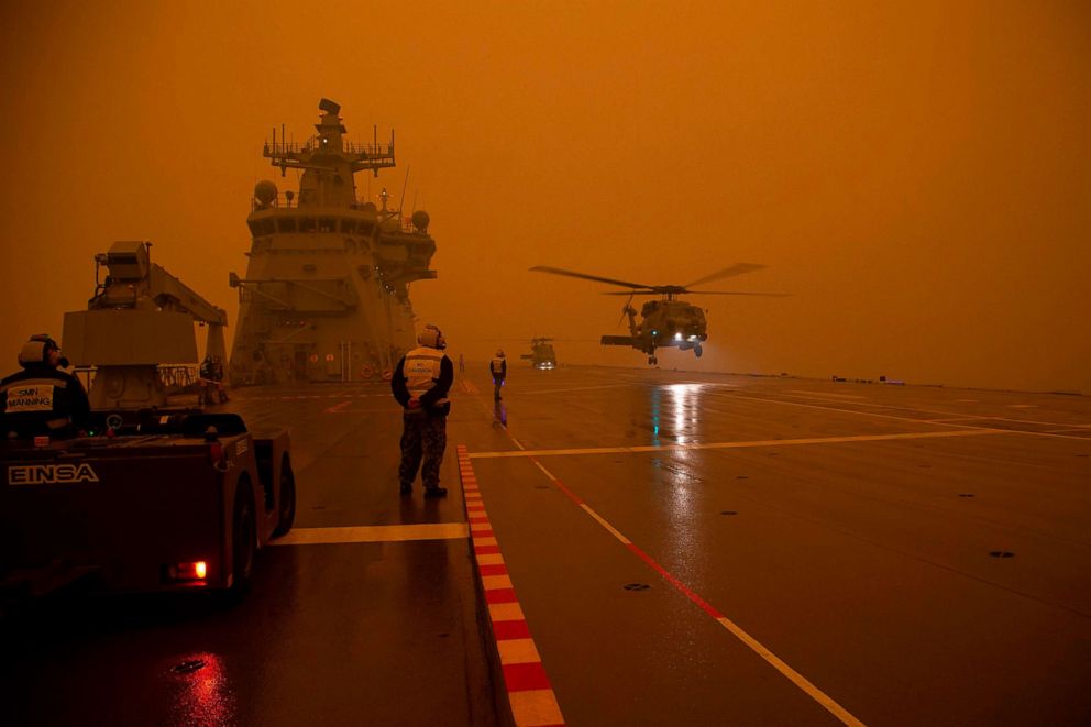 A Royal Australian Navy helicopter departs HMAS Adelaide as part of bushfire relief operations, Jan. 5, 2020.A Royal Australian Navy helicopter departs HMAS Adelaide as part of bushfire relief operations, Jan. 5, 2020.
