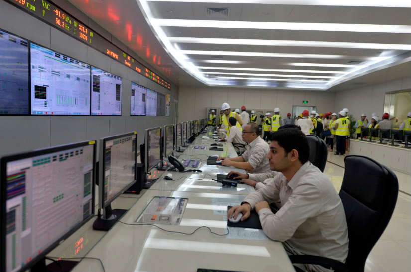 People work in the control room of the Sahiwal coal-fired power plant in Sahiwal, Punjab Province, Pakistan, on Aug. 6, 2019. (Xinhua/Ahmad Kamal)