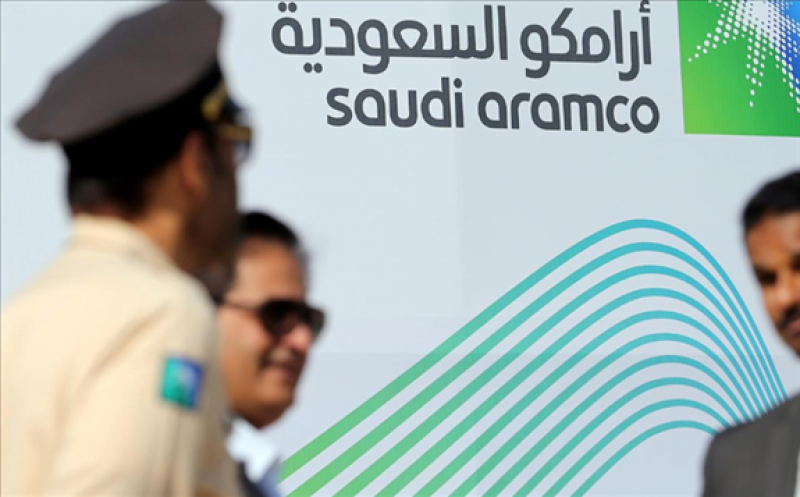 FILE PHOTO: The logo of Aramco is seen as security personnel stand before the start of a press conference by Aramco at the Plaza Conference Center in Dhahran, Saudi Arabia November 3, 2019. REUTERS/Hamad I Mohammed