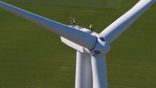 Workers test a new turbine in 2019 at DTE Energy's Pine River wind farm in mid-Michigan, near where the utility recently activated 68 new turbines, the company announced on April 23, 2020. 