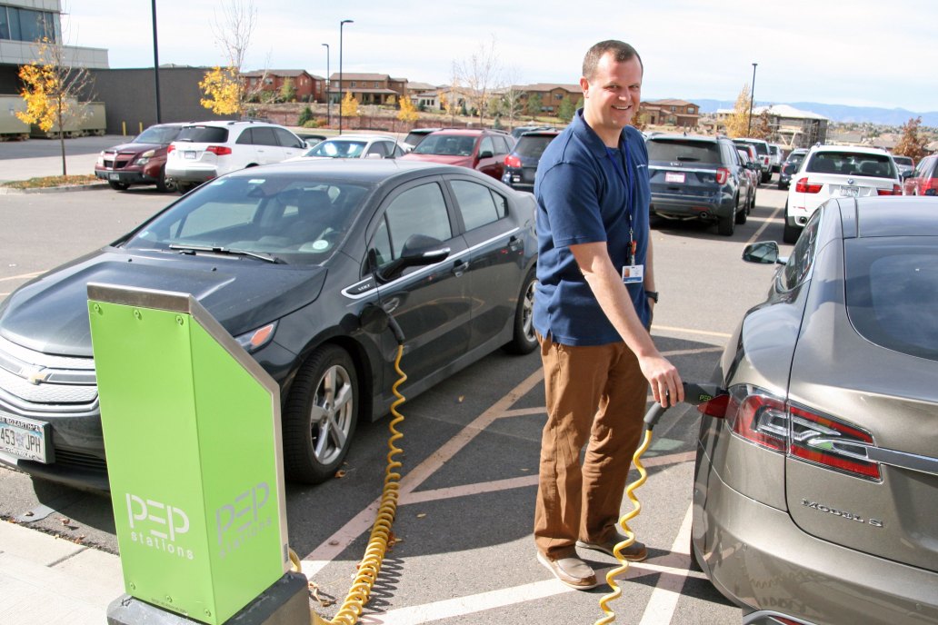 Family physician Dr. Adam Carewe takes advantage of a free charger station for his electric vehicle at Kaiser's Lone Tree office.
