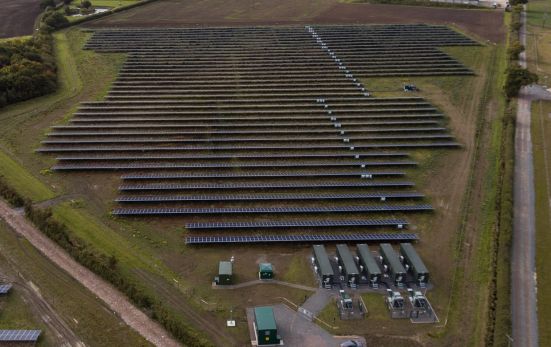 Clayhill, a solar farm with colocated battery storage, developed and built without subsidies in the UK. Image: Anesco.