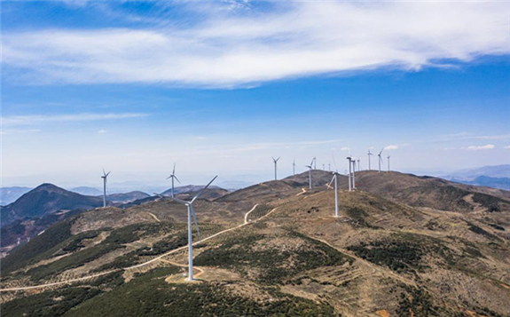 Aerial photo taken on April 26, 2020 shows power-generating windmill turbines in Weining County, southwest China's Guizhou Province. (Xinhua/Tao Liang)