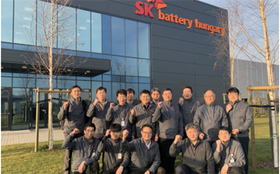 Ji Dong-seop (third from right in the second row), CEO of SK Innovation’s battery business, poses for a commemorative photo with officials of SK Battery Hungary during a visit to the company’s factory in February 2020.