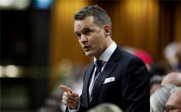 FILE PHOTO: Canada's Minister of Natural Resources Seamus O'Regan speaks during Question Period in the House of Commons on Parliament Hill in Ottawa, Ontario, Canada December 10, 2019. REUTERS/Blair Gable/File Photo