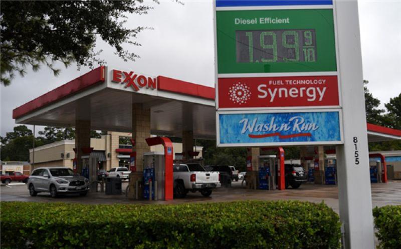 Exxon has for the first time released emissions data from customers’ burning its fuels, including drivers who fill up at the company’s gas stations. Photographer: Callaghan O'Hare/Bloomberg