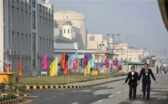 FILE - Pakistani officials walk before the inaugural ceremony of The Chashma-III reactor, a collaboration with China, in Chashma, in this handout photograph released by Pakistan Prime Minister's Office, Dec. 28, 2016.