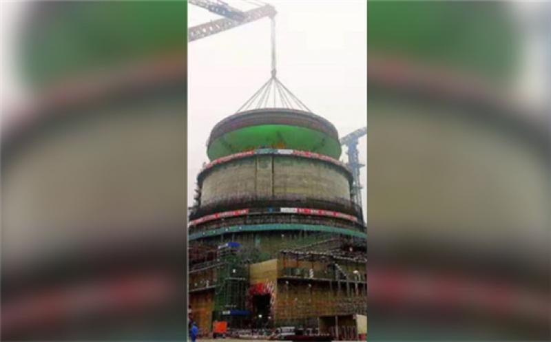 The hoisting of the dome onto the top of Fangchenggang unit 4's containment building (Image: NNSA)