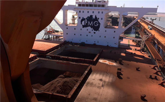FILE PHOTO: The logo of Australia's Fortescue Metals Group (FMG) can be seen on a bulk carrier as it is loaded with iron ore at the coastal town of Port Hedland in Western Australia, November 29, 2018. Picture taken November 29, 2018. REUTERS/Melanie Burton/File Photo