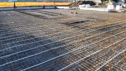 Electric heating wires will activate the concrete foundation of the building in the future.