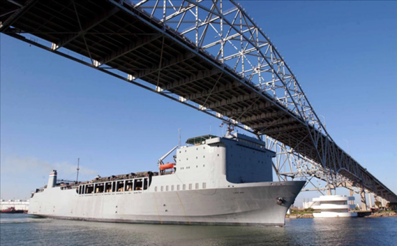 One of the US military ships, the Cape Ray, passing under the Harbor Bridge as it leaves the Port of Corpus Christi Feb. 10, 2003, loaded with military equipment. 