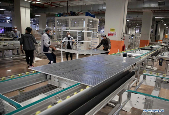 Employees work in the factory of HT Solar Energy in Istanbul, Turkey, on May 7, 2021. Turkey and China are mutually benefiting from each other's advantages in the field of solar panel production. (Photo by Osman Orsal/Xinhua)