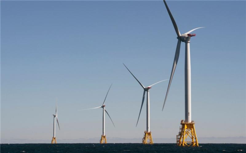 DON EMMERT/AFP Via Getty Images / AFP Wind turbines, of the Block Island Wind Farm, tower above the water on October 14, 2016 off the shores of Block Island, Rhode Island. The first offshore wind project in the US has created more than 300 construction jobs and will deliver the electricity demands for the entire island.