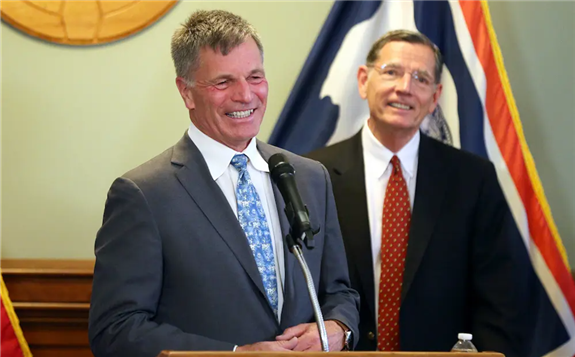 Gov. Mark Gordon smiles at the podium while U.S. Sen. John Barrasso (R-Wyo.) stands behind him during the press conference announcing efforts to advance a Natrium reactor demonstration project at a retiring coal plant June 2, 2021, inside the Wyoming Capitol. (Michael Cummo/Wyoming Tribune Eagle/Wyoming News Exchange)