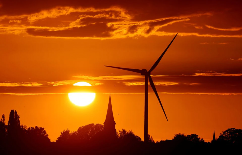 A power-generating windmill turbine is pictured during sunset at a renewable energy park in Ecoust-Saint-Mein, France, September 6, 2020. REUTERS/Pascal Rossignol/File Photo