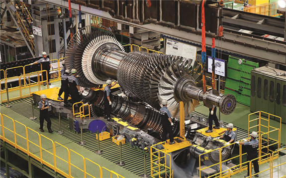 Doosan Heavy Industries & Construction employees working on the final assembly of the 270-MW large gas turbine model that will be demonstrated at the 500-MW liquefied natural gas–fired Gimpo Cogeneration Plant in South Korea in 2023. Courtesy: DHIC