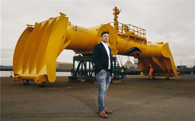 Mocean Energy’s Managing Director Cameron McNatt with Mocean Energy's Blue X wave energy converter at Forth Ports’ Rosyth Docks.