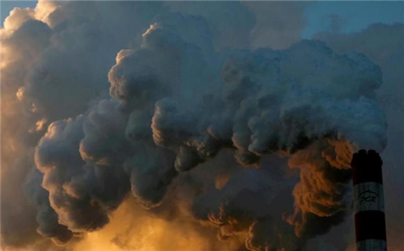 Smoke and steam billow from the Belchatow Power Station, Europe's largest coal-fired power plant, in Poland. About 33 gigatonnes of carbon dioxide were emitted around the world in 2019. Reuters