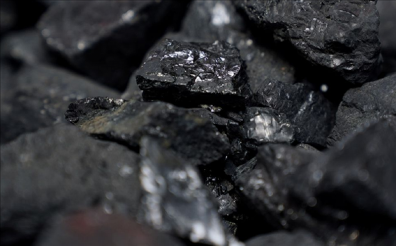 Coal is pictured in a container as people protest against BlackRock investing in coal and tar sands outside their headquarters in the Manhattan borough of New York City, New York, U.S., May 25, 2021. REUTERS/Carlo Allegri  July 14 (Reuters) - The Energy Information Administration (EIA) on Wednesday said U.S. coal production fell in 2020 to its lowest level since 1965 due to low global demand in the wake of the coronavirus pandemic.  The federal agency said in a report that U.S. coal production totaled 535 million short tons (MMst) in 2020, a 24% decrease from the 706 MMst mined in 2019.