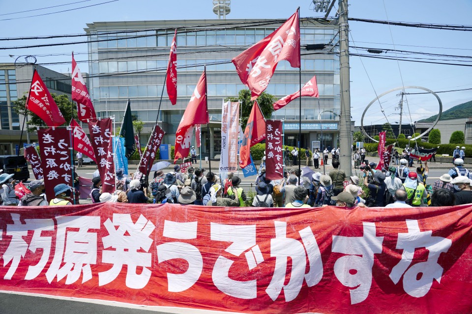 People stage a protest against the restart of the No. 3 reactor of the Mihama nuclear power plant in front of an office of the plant operator Kansai Electric Power Co. in Mihama, Fukui Prefecture, on June 23, 2021. The reactor restarted the same day, becoming Japan's first nuclear unit to operate beyond the government-mandated 40-year service period introduced under new rules set after the 2011 Fukushima disaster. (Kyodo) ==Kyodo