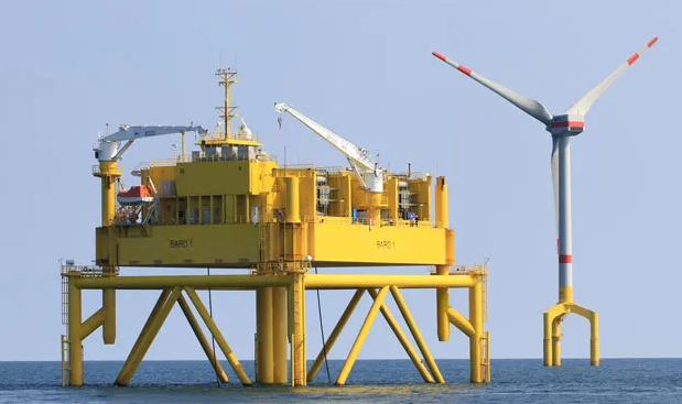 North Wind: Turbine construction is on the rise off Germany’s North Sea coast. The Bard Offshore 1 wind farm will boast 80 turbines. One such turbine is shown here alongside an HVDC converter platform. PHOTO: BARD ENGINEERING