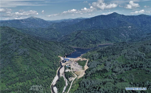 Aerial photo taken on July 29, 2021 shows a view of the China-built Turgusun hydropower station on the Turgusun River near the city of Altai, Kazakhstan. The China-built Turgusun hydropower plant has been operating at full capacity since mid-July and will help ease a power shortage in East Kazakhstan Region. Built by the China International Water and Electric Corporation, a subsidiary of the China Three Gorges Corporation, the station has an installed capacity of 24.9 MW, producing up to 79.8 million kilowatt hours of electricity per year. (Photo by Kalizhan Ospanov/Xinhua)