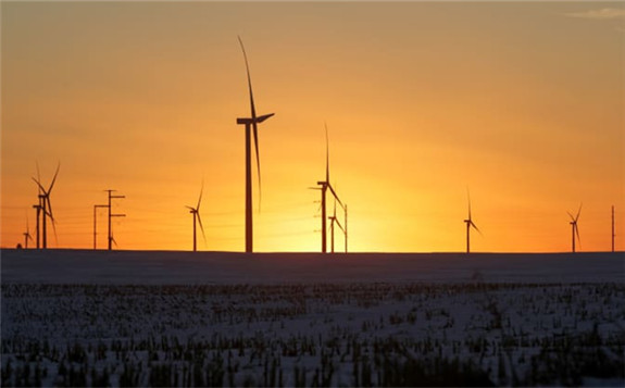 A wind farm shares space with corn fields the day before the Iowa caucuses, where agriculture and clean energy are key issues, in Latimer, Iowa, February 2, 2020. Jonathan Ernst | Reuters