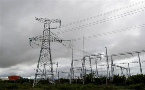 Rain clouds move over electric towers of Hong Kong-listed power generation company VPower Group, which recently suspended two of its nine power stations in Myanmar, at the Thilawa Special Economic Zone, outskirts of Yangon, Myanmar, 23 September 2021. -EPA PIC