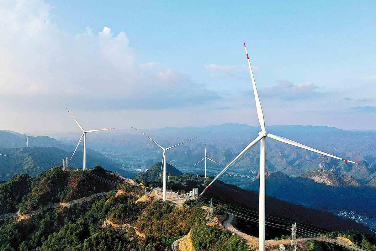 Wind turbines in Rong'an county, Liuzhou, Guangxi Zhuang autonomous region, are examples of the nation's progress in creating cleaner energy. TAN KAIXING/FOR CHINA DAILY