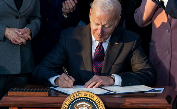 President Biden signing the act yesterday (Image: The White House)