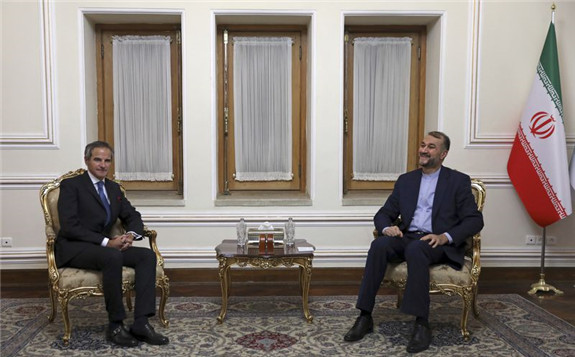 The head of the International Atomic Energy Agency, Rafael Mariano Grossi, left, and Iranian Foreign Minister Hossein Amirabdollahian met in Tehran Nov. 23 ahead of diplomatic talks restarting over Iran's nuclear deal with world powers. (AP Photo/Vahid Salemi) (Vahid Salemi/AP Photo)