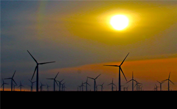 A wind farm is seen in Hami, Xinjiang Uygur autonomous region, in February. [Photo by CAI ZENGLE/FOR CHINA DAILY]