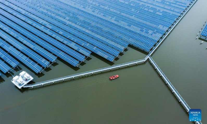 Aerial photo taken on Dec. 15, 2021 shows a 550 megawatts photovoltaic (PV) power station in Wenzhou, east China's Zhejiang Province. The PV power station in Wenzhou, covering a water area of 4.7 square kilometers, was successfully connected into the grid on Thursday. The project has combined fishery breeding and photovoltaic power generation. (Xinhua)