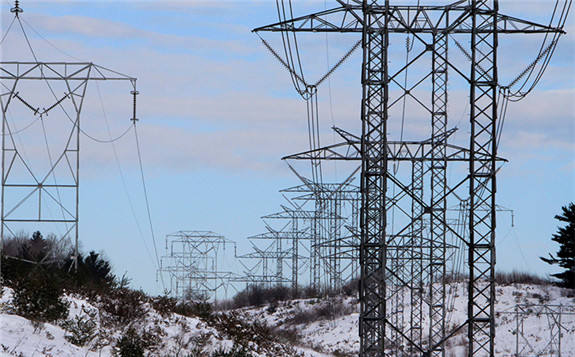Transmission lines run through the hills of New Hampshire. AP Photo/Jim Cole